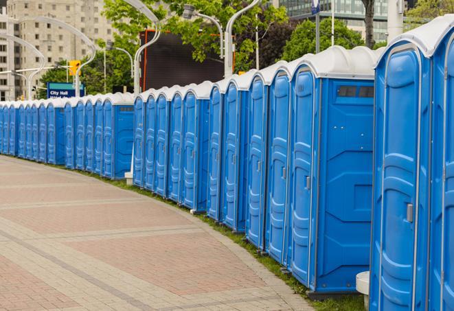 a row of portable restrooms at an outdoor special event, ready for use in Franklin, OH